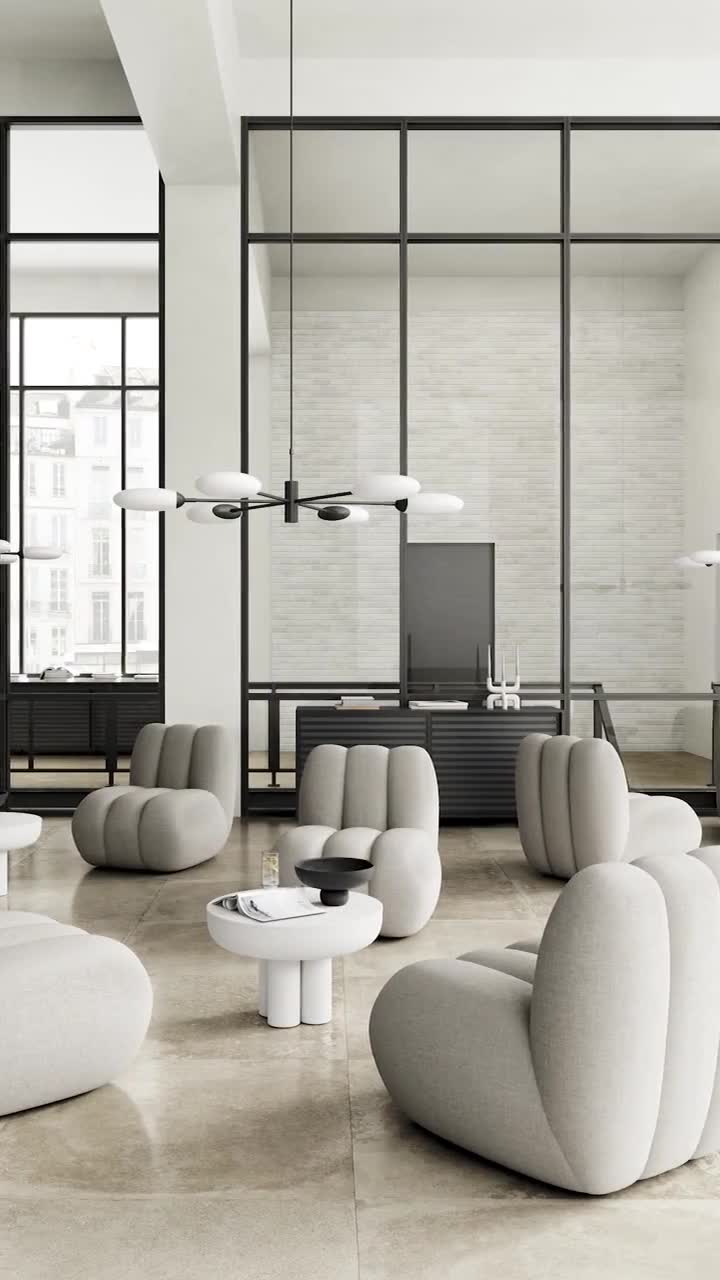 A furnished showroom floor, seen through glazed doors