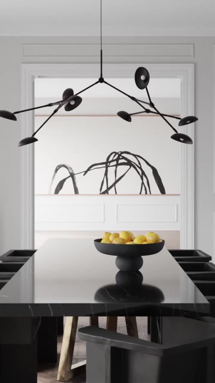 A dining room set with a black marble table